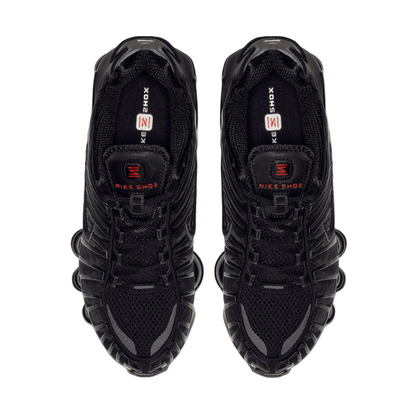 Black Nike sneakers with visible branding on a white background